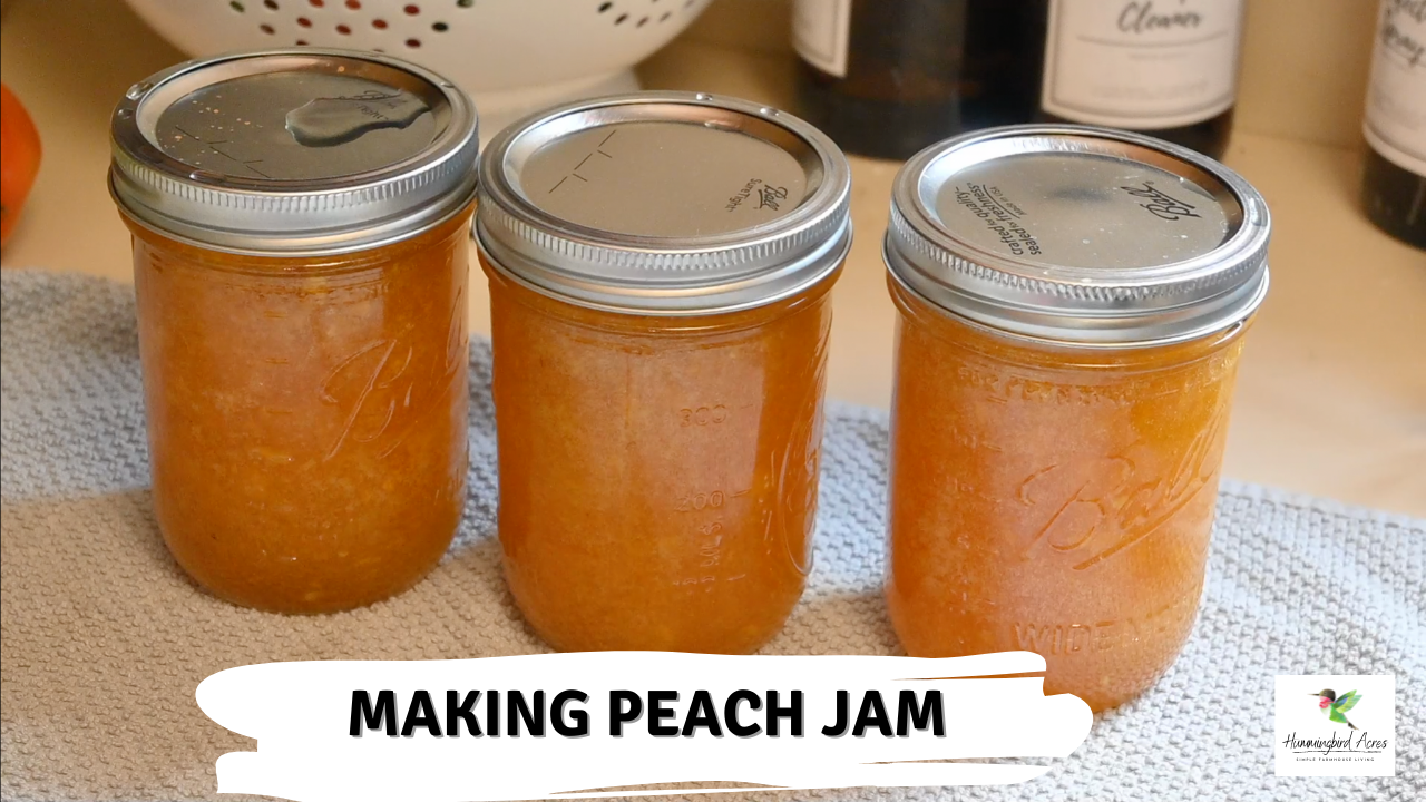 Peach Jam sitting on a gray kitchen towel